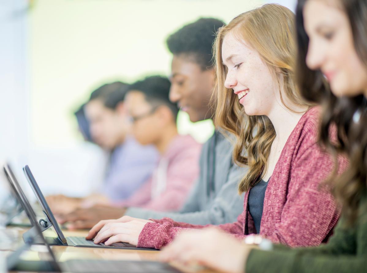Young people working on laptop computers
