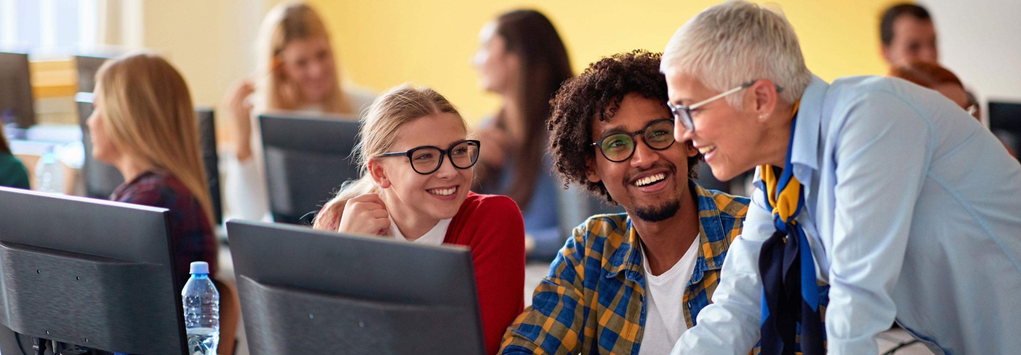 People in a classroom with computers